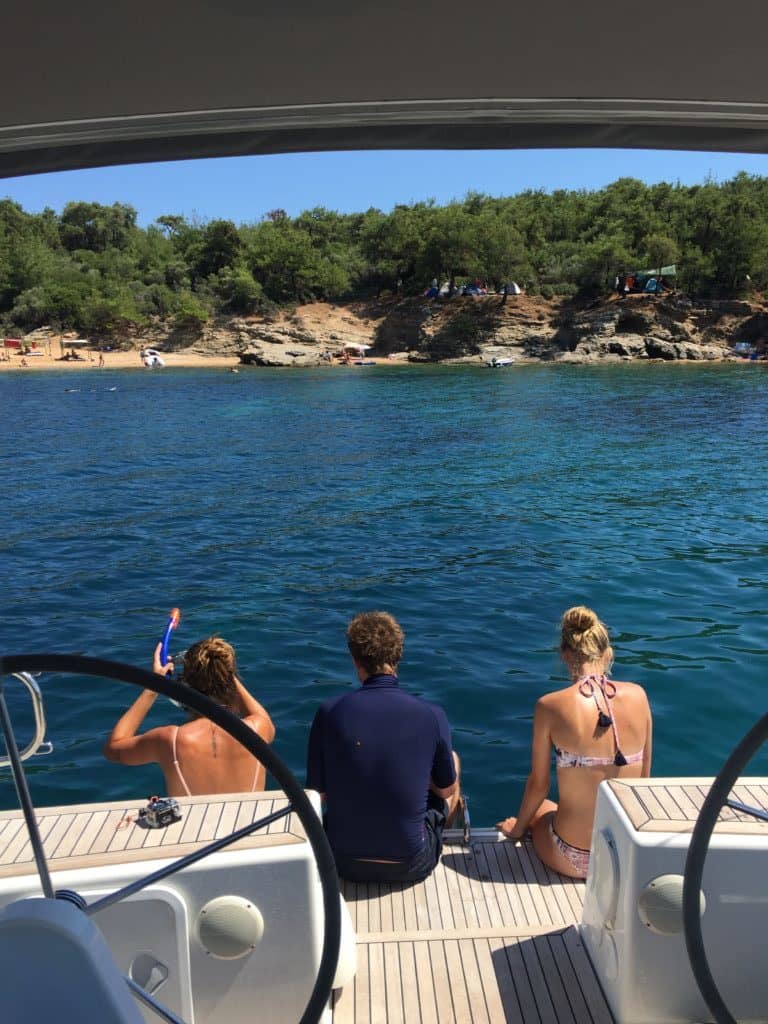 tourists at Salonikios Beach ready to dive 