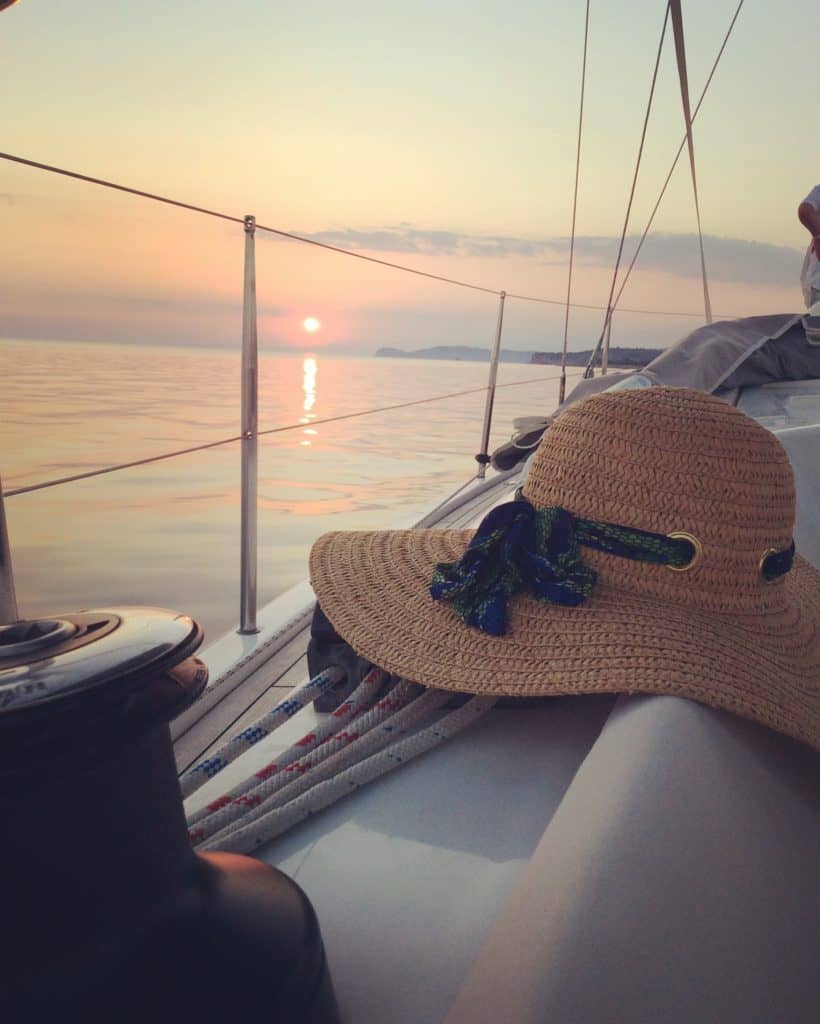 sunset at Aeolus yacht and hat
