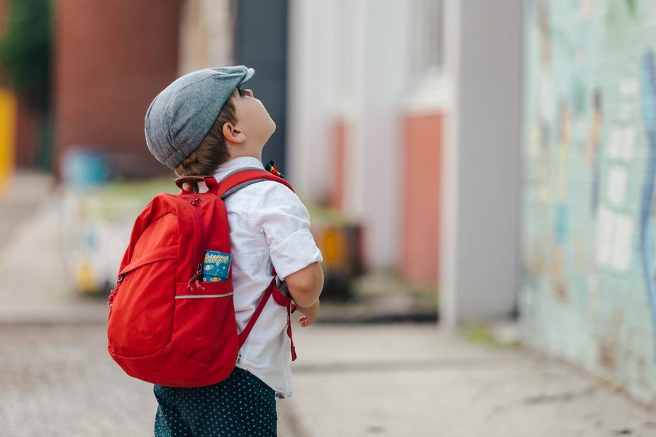 little-boy-ready-for-school-looking-up